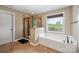 Bathroom featuring large tub, shower and beautiful view at 8137 Caliterra Dr, Charlotte, NC 28227