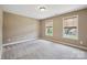Bright bedroom with two windows providing ample natural light at 8137 Caliterra Dr, Charlotte, NC 28227