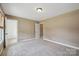 Spacious bedroom with carpet, two windows, and neutral paint at 8137 Caliterra Dr, Charlotte, NC 28227