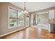 Inviting dining area with hardwood floors, bright windows, and access to the backyard at 8137 Caliterra Dr, Charlotte, NC 28227