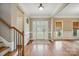 Welcoming foyer with hardwood floors and decorative front door at 8137 Caliterra Dr, Charlotte, NC 28227