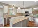 Well-appointed kitchen featuring granite countertops, a center island, and white cabinetry at 8137 Caliterra Dr, Charlotte, NC 28227