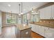 Beautiful kitchen with granite countertops, stainless steel appliances, and an island at 8137 Caliterra Dr, Charlotte, NC 28227