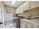 Well-equipped laundry room with ample cabinet space and modern appliances at 8137 Caliterra Dr, Charlotte, NC 28227