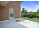 Covered patio area overlooking the lawn, ideal for enjoying the outdoors in comfort at 8137 Caliterra Dr, Charlotte, NC 28227