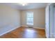Bright bedroom featuring hardwood floors and a window that provides plenty of natural light at 823 Yuma St, Charlotte, NC 28213