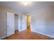 Bedroom with hardwood floors, closet, and view to the bathroom at 823 Yuma St, Charlotte, NC 28213