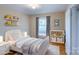 Charming bedroom with a daybed, decor shelves, and plush rug for cozy comfort at 823 Yuma St, Charlotte, NC 28213