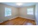 Bright bedroom featuring hardwood floors and two windows that provides plenty of natural light at 823 Yuma St, Charlotte, NC 28213