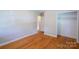 Bedroom featuring hardwood floors and a view through the door to another room at 823 Yuma St, Charlotte, NC 28213
