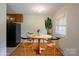 Cozy dining area with wood table and chairs, next to the kitchen, perfect for meals at 823 Yuma St, Charlotte, NC 28213