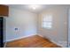Bright dining area with hardwood floors, natural light from a window near the kitchen appliances at 823 Yuma St, Charlotte, NC 28213