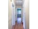View of the hallway with wood floors leading to an open room with natural light at 823 Yuma St, Charlotte, NC 28213