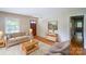 Cozy living room with hardwood floors, comfortable seating, and natural light creating a welcoming atmosphere at 823 Yuma St, Charlotte, NC 28213