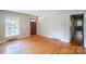 Bright living room featuring hardwood floors, neutral walls, and natural light from a large window at 823 Yuma St, Charlotte, NC 28213