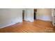 Spacious living room featuring hardwood floors, neutral walls, and ample natural light at 823 Yuma St, Charlotte, NC 28213