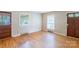 Bright living room featuring hardwood floors, natural light from windows, and neutral colored walls at 823 Yuma St, Charlotte, NC 28213