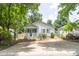 Charming home with a quaint front porch, a well-maintained yard, and a spacious driveway at 830 Mcarthur Ave, Charlotte, NC 28206
