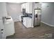 Bright kitchen with white cabinets, stainless steel appliances, and modern countertops at 830 Mcarthur Ave, Charlotte, NC 28206