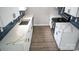 Bright kitchen with white cabinets, new countertops, and tile backsplash at 830 Mcarthur Ave, Charlotte, NC 28206