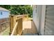 Side view of the house and the new wooden deck at 830 Mcarthur Ave, Charlotte, NC 28206