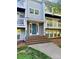 A welcoming front entrance with a blue door and well-maintained landscaping at 9541 Shannon Green Dr, Charlotte, NC 28213