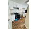 Bright kitchen with white cabinets, granite countertops, and stainless steel appliances at 9541 Shannon Green Dr, Charlotte, NC 28213
