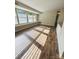 Bright living room featuring large windows and wood-style flooring at 9541 Shannon Green Dr, Charlotte, NC 28213