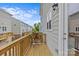 Cozy balcony with wooden floors and flower table for outdoor enjoyment at 9620 Ainslie Downs St, Charlotte, NC 28273