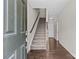 Welcoming entryway with hardwood floors, staircase, and neutral walls at 9620 Ainslie Downs St, Charlotte, NC 28273