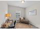 This home office has a chair, desk, and large window at 9620 Ainslie Downs St, Charlotte, NC 28273