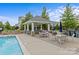 Community pool featuring an inviting covered patio with tables and chairs for residents to enjoy at 9620 Ainslie Downs St, Charlotte, NC 28273