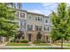 Charming multi-colored townhome with a stone facade and well-manicured lawn and mature landscaping at 9620 Ainslie Downs St, Charlotte, NC 28273