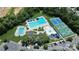 An aerial view of the neighborhood pool, tennis courts, playground, and clubhouse with parking at 9792 Ravenscroft Nw Ln, Concord, NC 28027