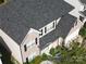 An aerial view of a charming home with a well-maintained roof and manicured landscaping at 9792 Ravenscroft Nw Ln, Concord, NC 28027