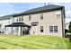 Backyard view features a shaded patio area, perfect for relaxation and enjoyment at 9792 Ravenscroft Nw Ln, Concord, NC 28027