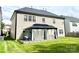 A cozy backyard featuring a covered patio area for outdoor relaxation and entertainment at 9792 Ravenscroft Nw Ln, Concord, NC 28027