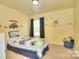 A bright bedroom featuring themed decor, including a charming Route 66 design at 9792 Ravenscroft Nw Ln, Concord, NC 28027