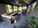 Gazebo features ample seating, a table, a bar, and views of the green backyard space at 9792 Ravenscroft Nw Ln, Concord, NC 28027
