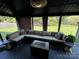 The lovely gazebo has ample seating, a table, and views of the green backyard at 9792 Ravenscroft Nw Ln, Concord, NC 28027