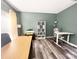 Inviting home office featuring modern décor, wood-look floors, and ample natural light at 9792 Ravenscroft Nw Ln, Concord, NC 28027