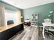 Inviting home office featuring modern décor, wood-look floors, and ample natural light at 9792 Ravenscroft Nw Ln, Concord, NC 28027