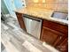 The kitchen area features stainless steel appliances and wood style flooring at 9792 Ravenscroft Nw Ln, Concord, NC 28027