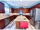 Updated kitchen features granite countertops, stainless steel appliances and a center island at 9792 Ravenscroft Nw Ln, Concord, NC 28027