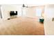 This large living room features neutral walls, carpeted flooring and plenty of space at 9792 Ravenscroft Nw Ln, Concord, NC 28027
