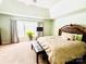 Main bedroom featuring neutral carpeting and a queen-sized bed at 9792 Ravenscroft Nw Ln, Concord, NC 28027