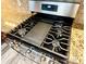 A stainless steel oven and stovetop range is shown at 9792 Ravenscroft Nw Ln, Concord, NC 28027