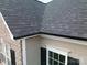 An aerial view of a home's roof, featuring durable shingles and clean gutter lines at 9792 Ravenscroft Nw Ln, Concord, NC 28027
