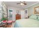 The bedroom features a dresser, plant, and glimpses into an adjoining bathroom space at 1006 Home Trl, Gastonia, NC 28052
