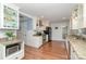 Modern kitchen with granite countertops, stainless steel appliances, and wood floors at 1006 Home Trl, Gastonia, NC 28052